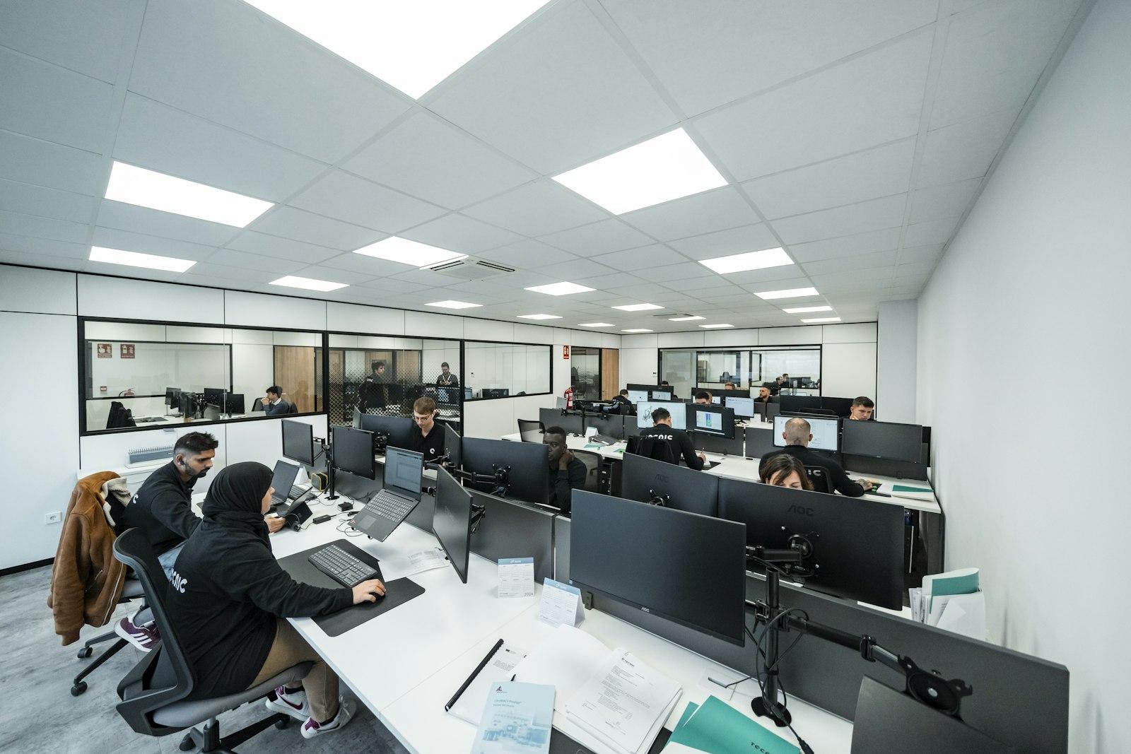 Developers working at computers in a bright office