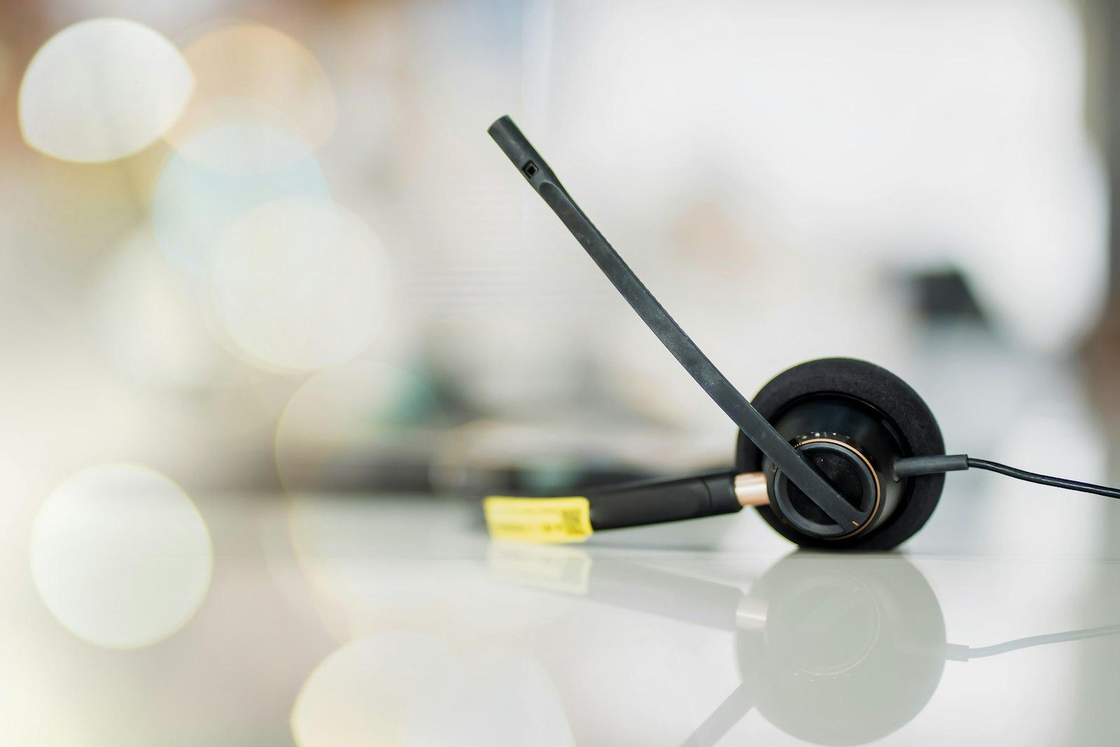 A headset with a microphone on a desk